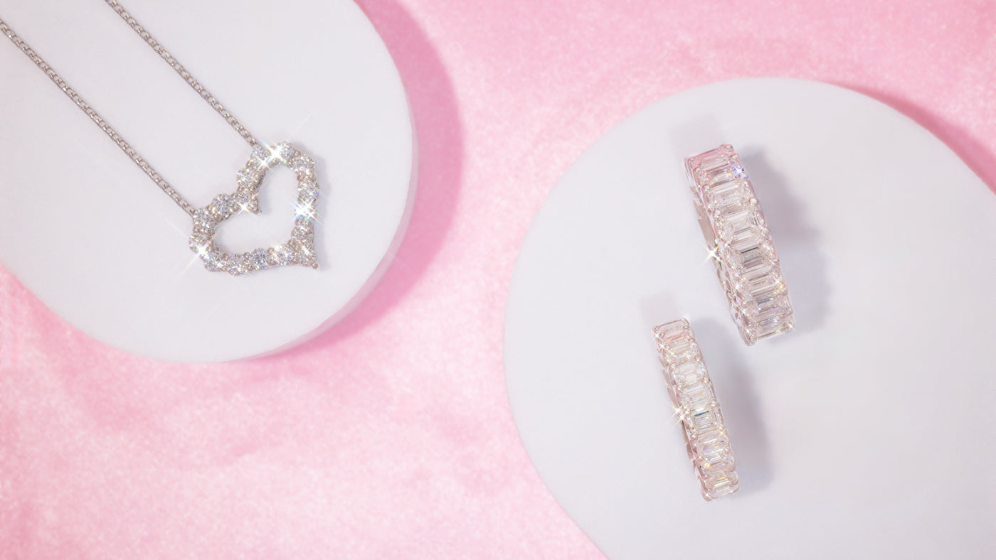 a pair of jewelry on white plates
